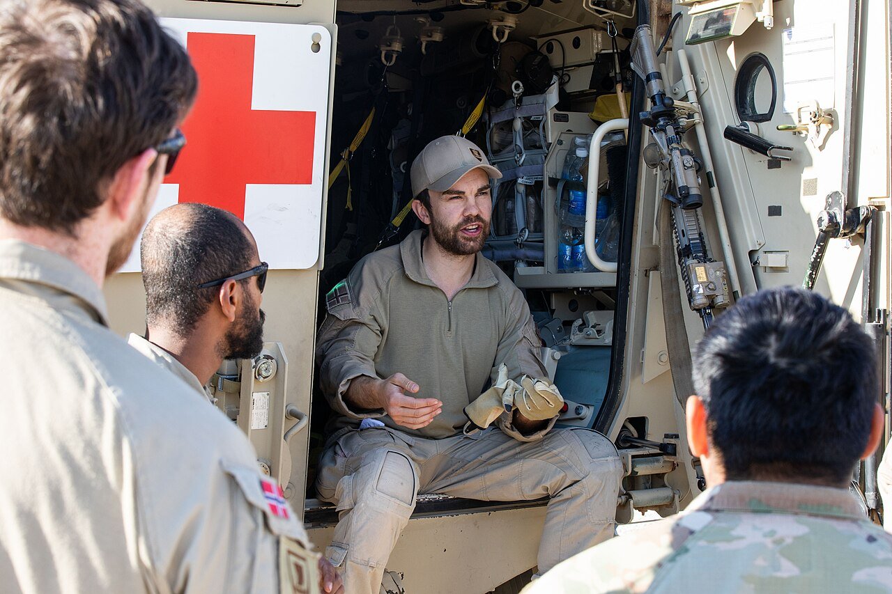 Norwegian and US coalition troops during medical evacuation training at Al Asad air base in western Iraq in December 2024.