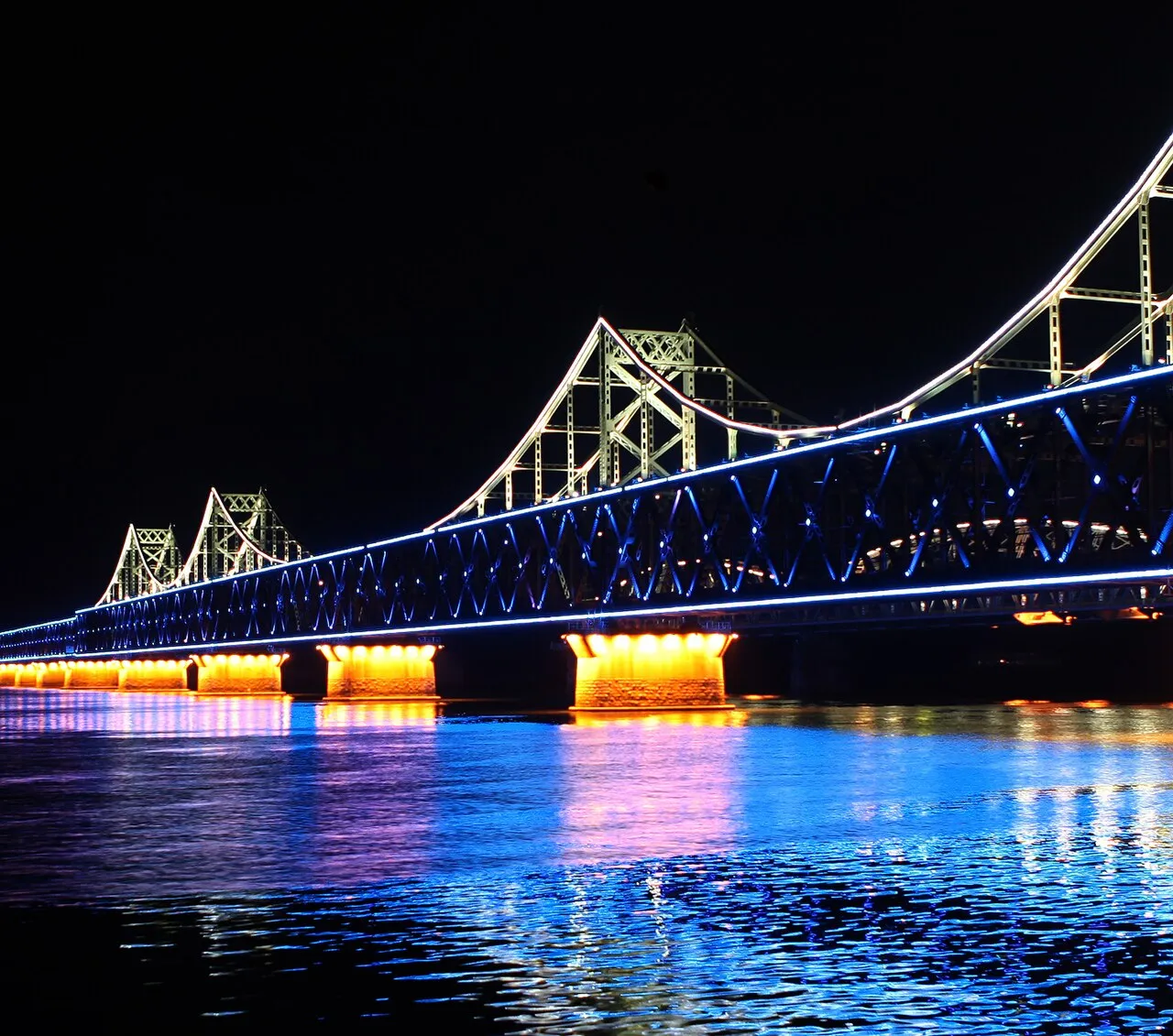 The Sino-Korean Friendship Bridge over the Yalu River, linking Dandong, in China, to Sinuiju, in North Korea, seen from the Chinese side in 2011.